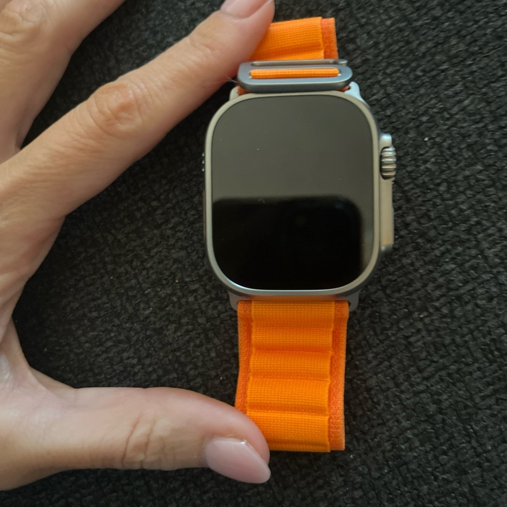 Apple Watch Ultra with bright orange woven loop band